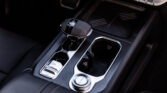 Close-up of a car's center console with an automatic gear shifter and chrome trim.