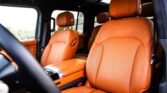 Luxurious orange leather car seats and headrests inside a premium vehicle interior