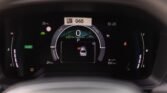 Digital car dashboard showing 0 km/h in park, eco mode active, with battery/charge indicators and a central vehicle graphic.